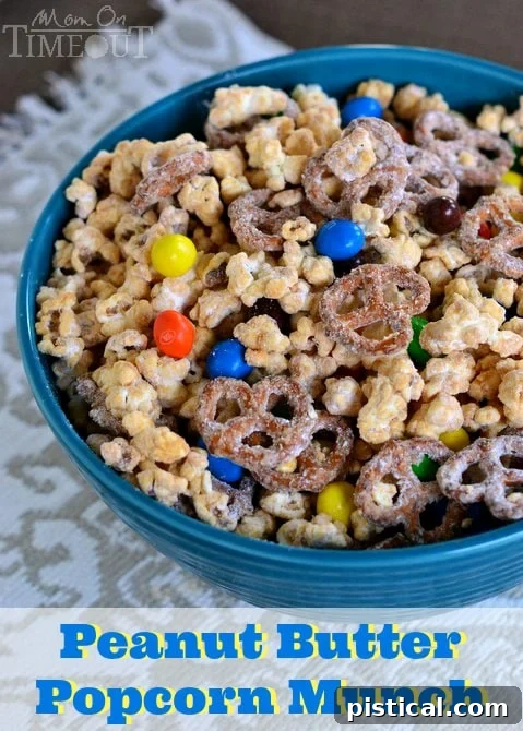 Delicious Peanut Butter Popcorn Munch recipe, perfect for game day or movie night. Sweet and salty snack with pretzels and M&M's.