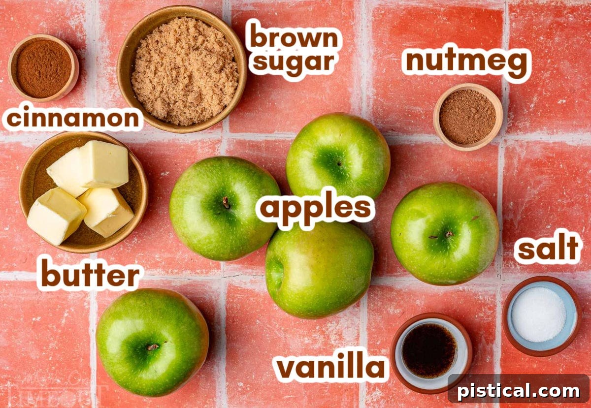 Overhead shot of all the ingredients for fried apples recipe laid out and ready to be used in the recipe. Each ingredient is labeled.