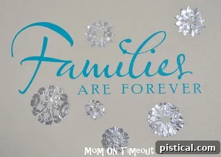 DIY Shiny Foil Snowflakes 2 Shiny aluminum foil snowflakes displayed on a wall, capturing the light beautifully
