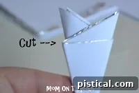 DIY Shiny Foil Snowflakes 10 Cutting off the small triangular excess pieces from the folded foil and paper to create a clean base