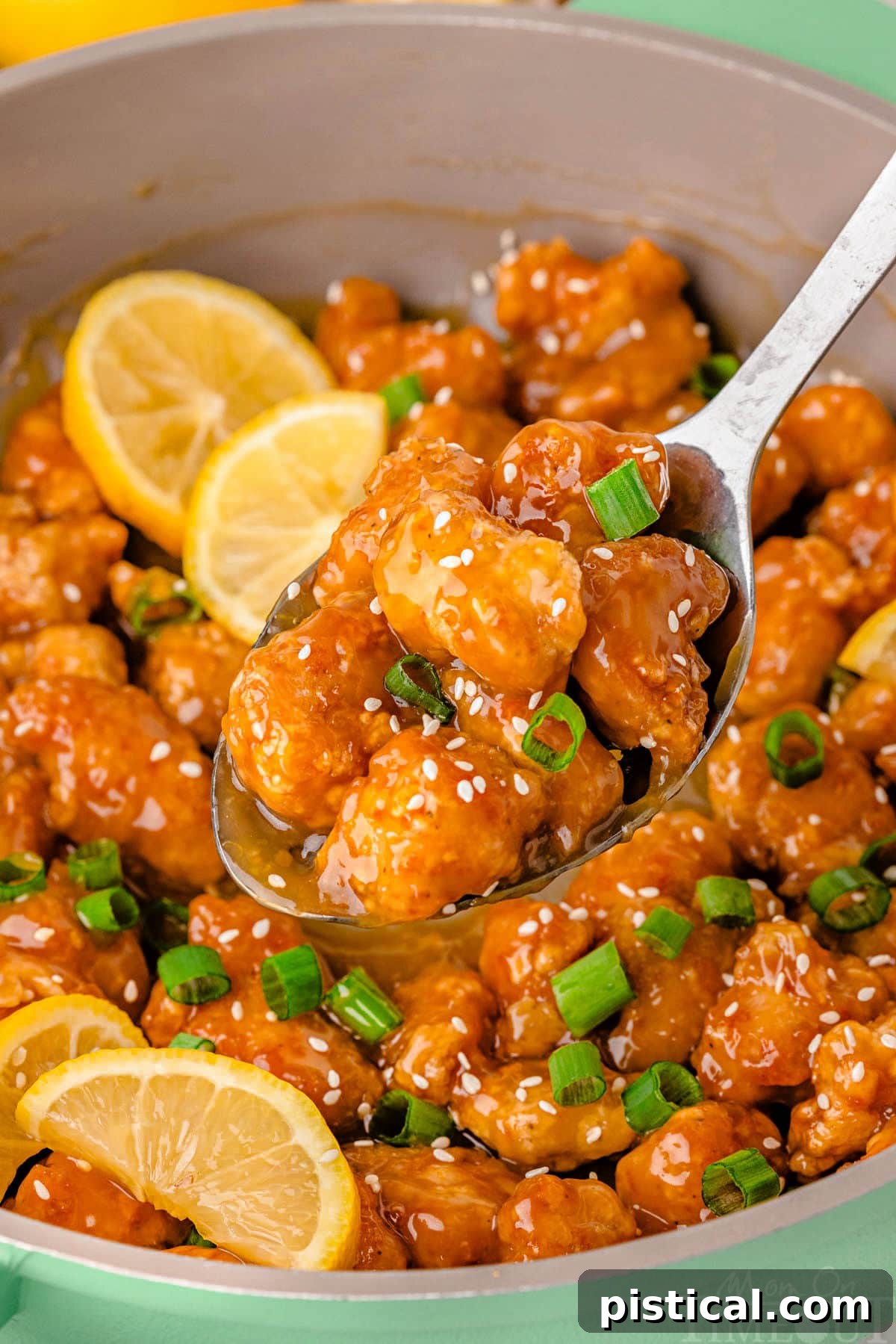 Lemon chicken chinese being served from skillet. Delicious Chinese Lemon Chicken being served directly from a hot skillet.
