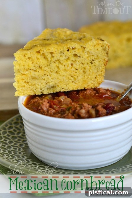 A serving of Slow Cooker Mexican Cornbread, ready to be enjoyed with a hot bowl of chili. | MomOnTimeout.com