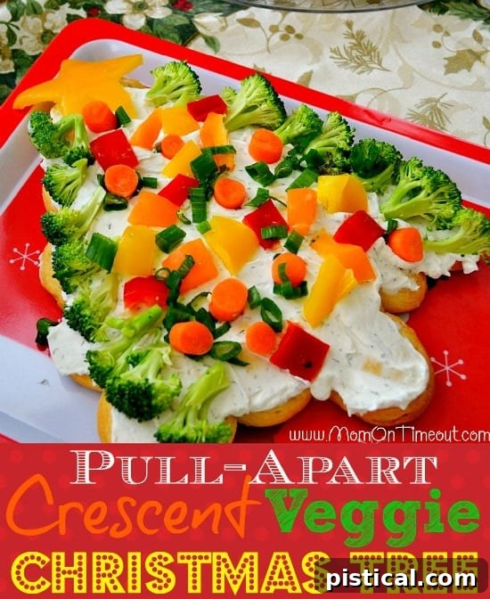 Festive Crescent Veggie Christmas Tree appetizer with cream cheese spread and colorful vegetables