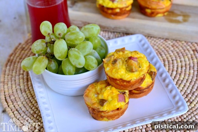 Close-up of golden-brown Potato, Ham and Cheese Crescent Mini Quiches in a muffin tin, ready to eat.