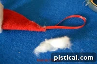 Black thread prepared for the mouse's whiskers