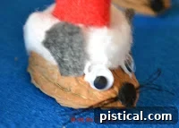 Gray felt body shape with an attached tail, cut out for the mouse