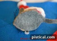 Whimsical Santa Mouse Ornament 19 Another view of a completed Santa Mouse ornament, held gently