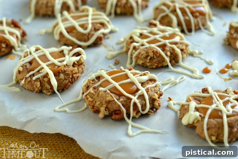 Freshly baked Caramel Spice Thumbprint Cookies with white chocolate drizzle, ready to be enjoyed.