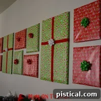 Small picture frame wrapped in festive paper, decorated with a tiny sprig and a tag