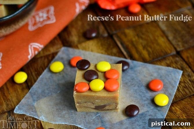 Close-up of freshly made Reese's Peanut Butter Fudge with Reese's Peanut Butter Cups embedded, perfect for a quick and easy dessert.