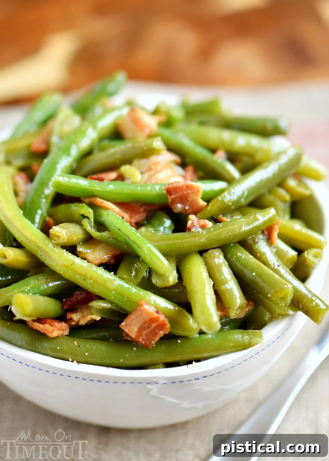 Serving bowl filled with Nana's famous green beans with bacon, ready to enjoy