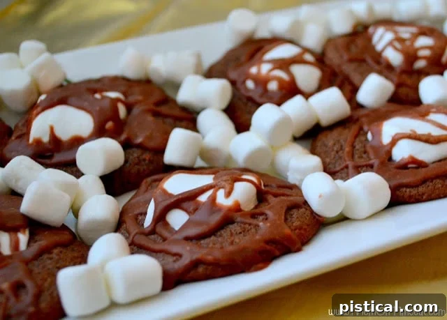 Homemade Marshmallow and Chocolate Cookies cooling on a rack, ready to be iced.