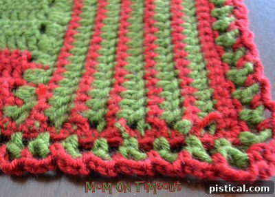 A closer view of the assembled crocheted blocks, showing the seamless connections and varied patterns of the runner.