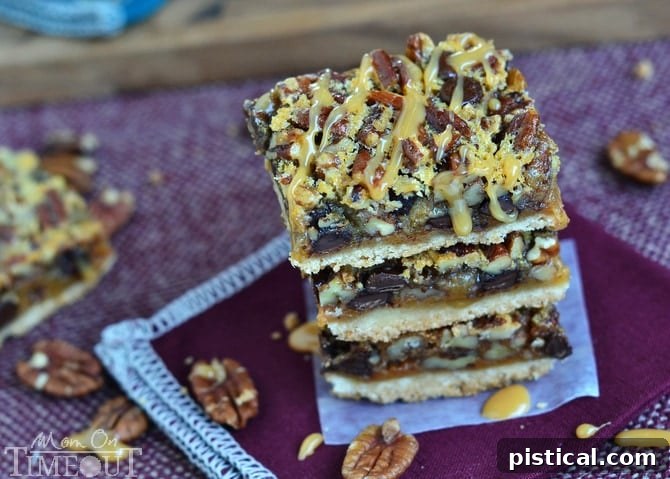 Close-up shot of a plate of freshly baked Turtle Pecan Pie Bars, highlighting the generous pecan topping and dark chocolate.