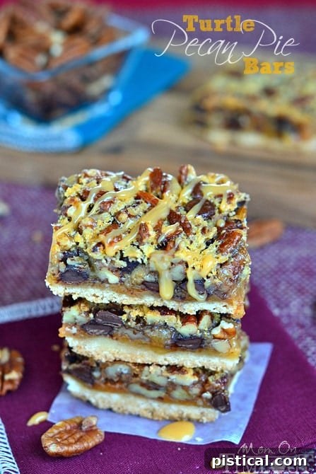 Close-up of a Turtle Pecan Pie Bar, showing the thick caramel drizzle on top of the chocolate and pecan filling.