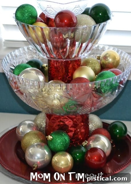 Finished multi-tiered Christmas centerpiece brimming with colorful shatterproof ornaments and additional festive decor