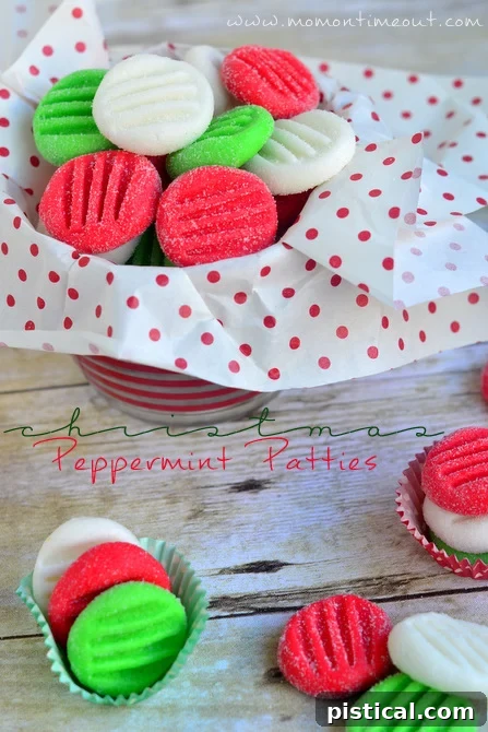 Close-up of freshly made red, green, and white peppermint patties on a festive background, highlighting their vibrant colors.