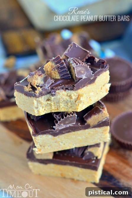 A tray of freshly cut Reese's Chocolate Peanut Butter Bars, ready to be served.