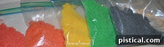 Vibrant array of homemade colored sugars in various shades displayed side-by-side.
