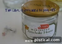 Jars prepared for label removal, showing initial peeling