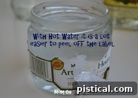 Jar filled with hot water to loosen the label