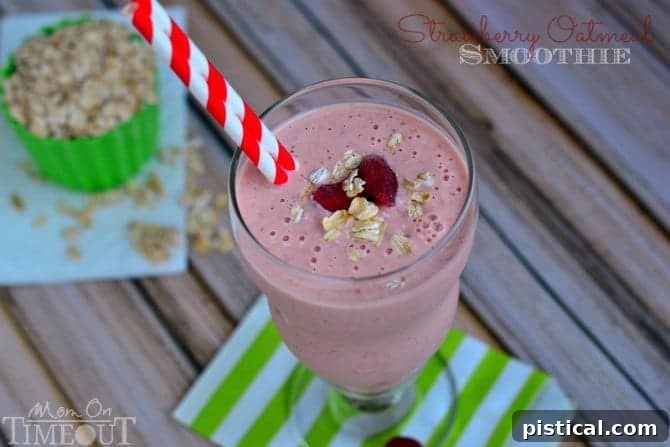 Close-up of a Strawberry Oatmeal Smoothie, highlighting the creamy texture and fresh strawberry garnish. A nutritious and satisfying drink.