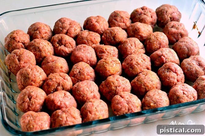 Grandma's Sweet and Sour Meatballs are baked to perfection while simmering in an amazing sauce made with pineapple chunks and green pepper. This family-friendly dinner is one you can turn to on busy weeknights. Super simple, super delicious! // Mom On Timeout #meatballs #dinner #pineapple #bellpepper #rice #easyrecipe #easydinner #momontimeout #entree #beef easy-sweet-and-sour-meatballs