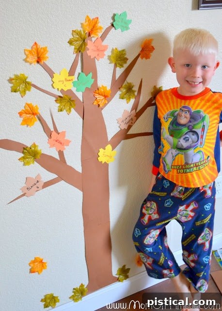 Our completed Thanksgiving Gratitude Tree, overflowing with messages of thankfulness from family and guests.