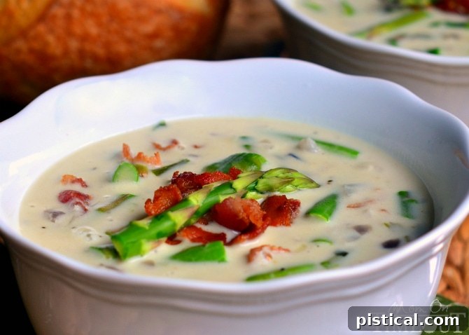 A Hearty Bowl of Creamy Asparagus Soup Creamy Asparagus Soup is so delicious and is just bursting with fresh flavor! Comfort food at it's best! | MomOnTimeout.com