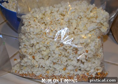 Crunchy Caramel Corn with Autumn Leaf Tags 3 Plain, warm popcorn in a large baking dish, ready for caramel