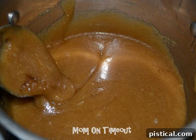 Crunchy Caramel Corn with Autumn Leaf Tags 5 Caramel sauce boiling vigorously in a saucepan, without being stirred