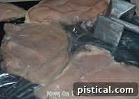 Pounding chicken breasts flat