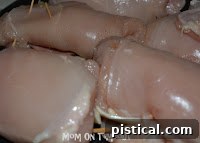 Rolling chicken cordon bleu with toothpicks