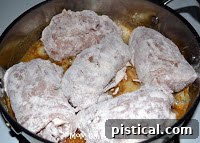 Browning chicken cordon bleu in a skillet