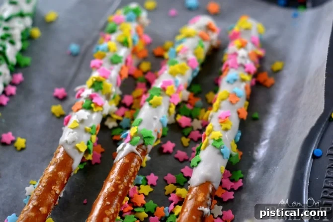 Fun and easy, these Rainbow Pretzel Wands take just minutes to make and are perfectly scrumptious! | MomOnTimeout.com
