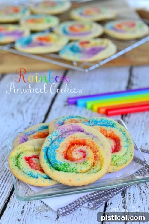 These gorgeous Rainbow Pinwheel Cookies are super easy to make and are so much fun! | MomOnTimeout.com rainbow cookies made with sugar cookie dough