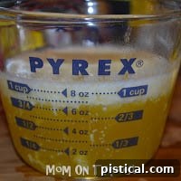Melted butter in a Pyrex measuring cup, ready for the hollandaise sauce.