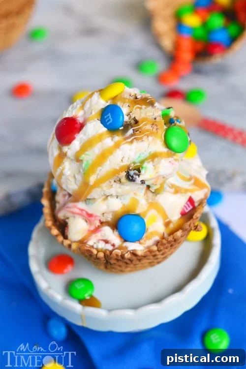 Close-up of Monster Cookie Dough Ice Cream in a bowl, enhanced with a generous caramel drizzle, making it even more tempting and visually appealing.