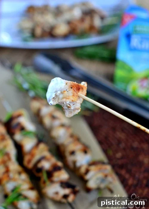 Plated Rosemary Buttermilk Ranch Chicken Skewers with fresh rosemary garnish