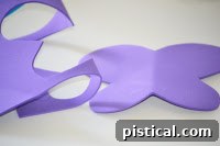 Purple butterfly wing shape cut out from a folded foam sheet
