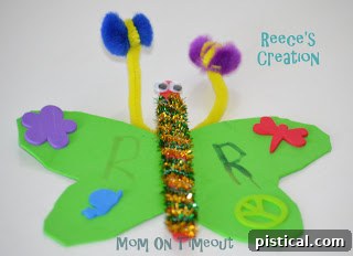 Child's completed butterfly craft, vibrant and uniquely decorated with an 'R' initial