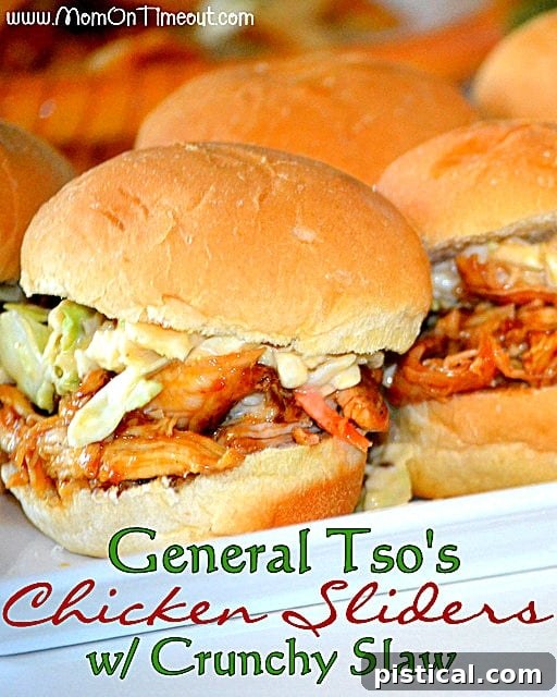 Delicious General Tso's Chicken Sliders with Crunchy Slaw on a white serving tray, ready for a party.