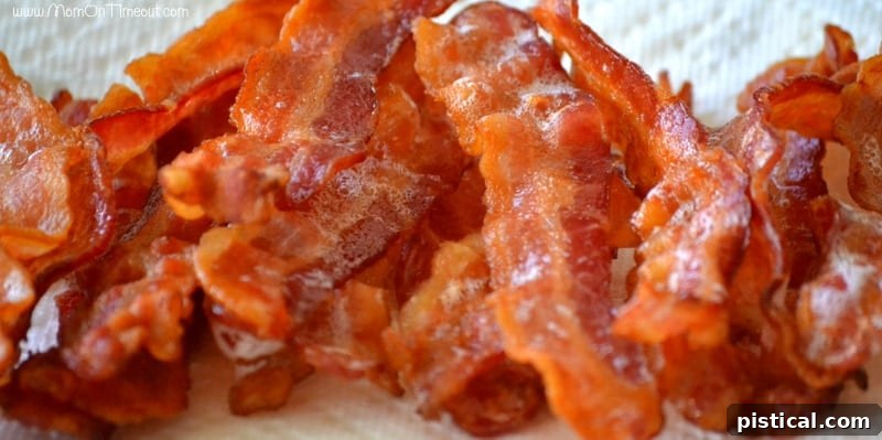 Ready When You Are Breakfast Burritos 3 baked bacon on a paper towel