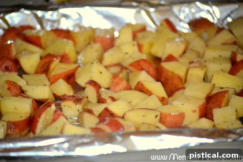 Ready When You Are Breakfast Burritos 4 Roasted red potatoes on a foil lined baking sheet