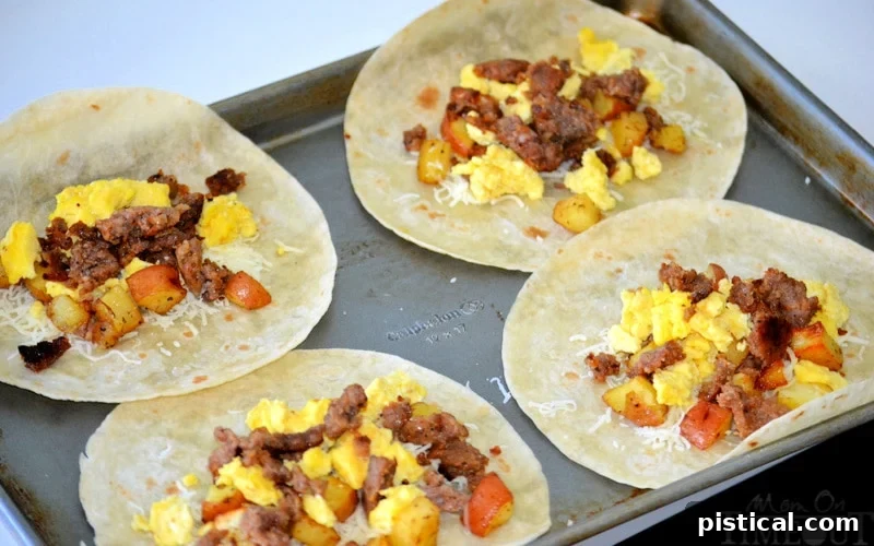 Ready When You Are Breakfast Burritos 8 four breakfast burritos being made on baking sheet
