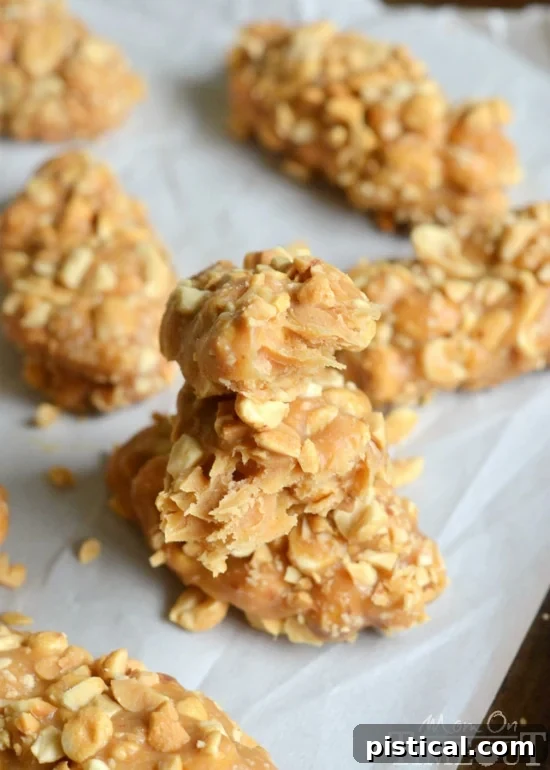 A stack of four-ingredient, no-bake peanut butter candy bars, ready for enjoyment as a quick and easy snack.