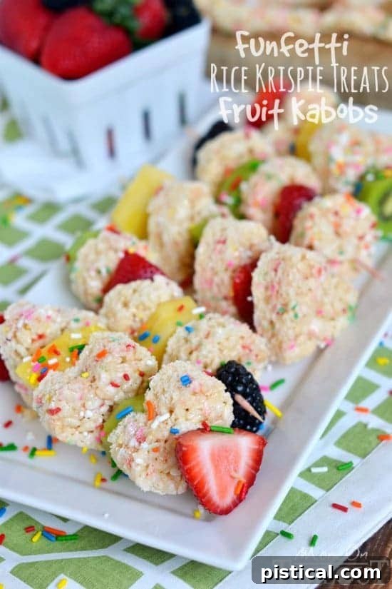 Colorful Funfetti Rice Krispies Treats Fruit Kabobs on a white plate, perfect for easy snacks or party desserts