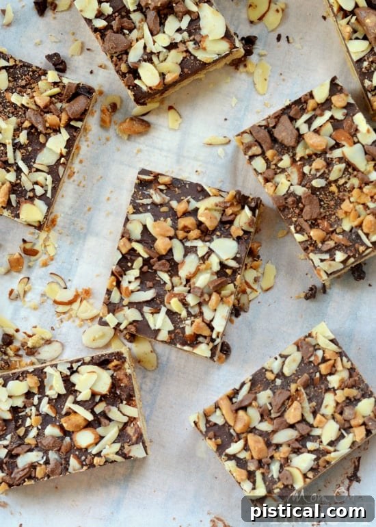 Stacks of perfectly cut Toffee Cookie Bars on a white plate, ready for serving