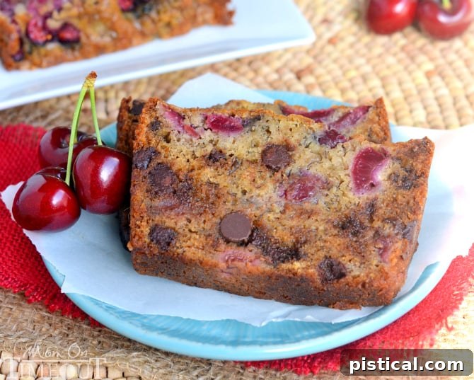 Close-up of a slice of moist Chocolate Cherry Banana Bread, revealing its tender crumb and delightful mix of chocolate chips and fresh cherry pieces.