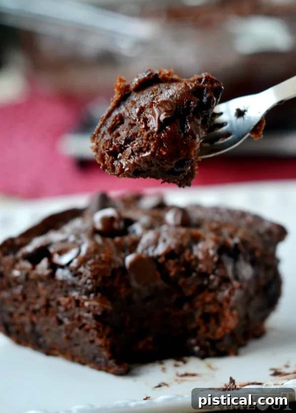 Beautifully moist and decadent, this one-bowl Chocolate Banana Applesauce Cake is made without oil, eggs, or butter. The perfect snack cake that needs no frosting! // Mom On Timeout